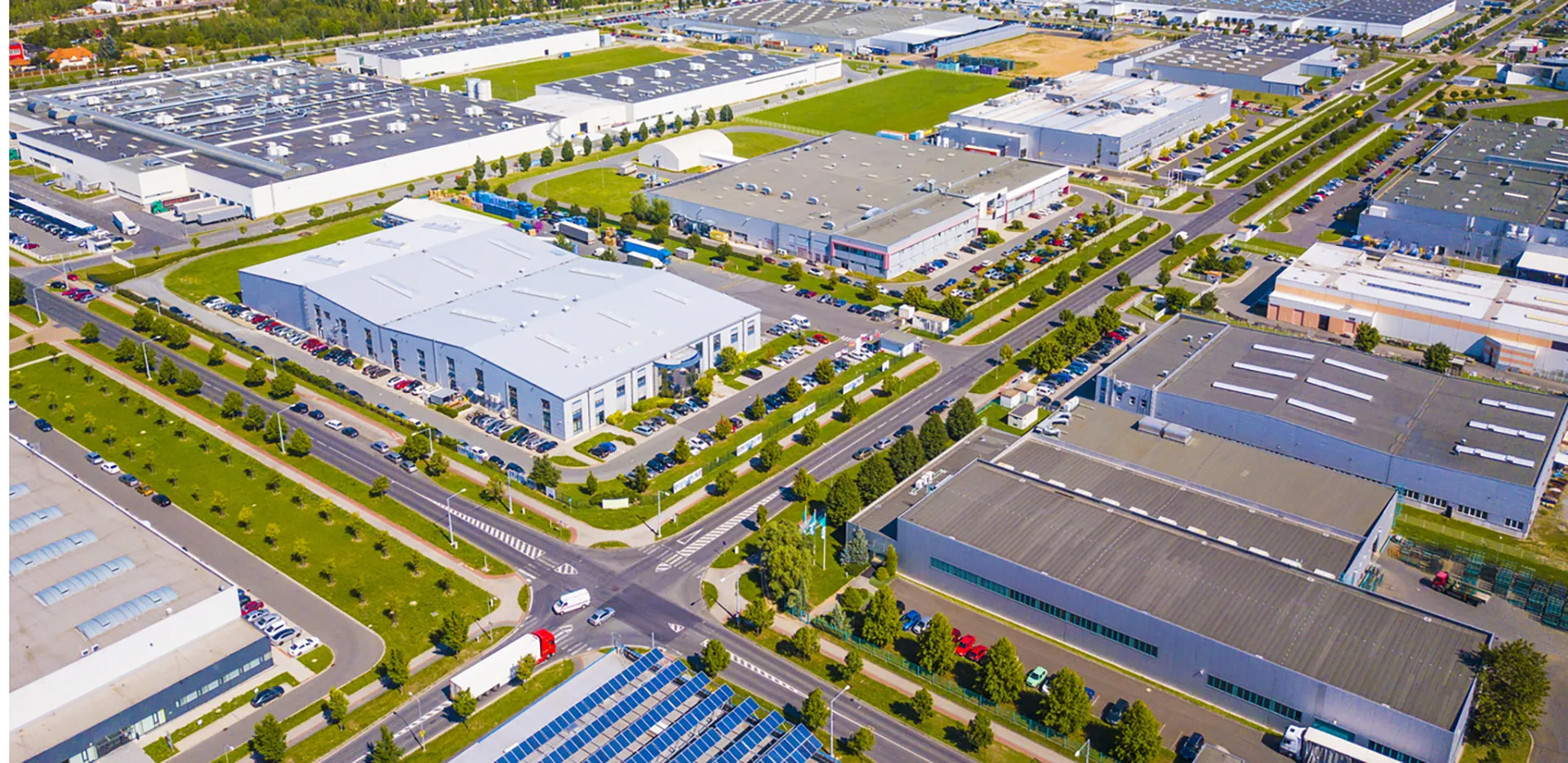A bird's eye view of a commercial district with office buildings and warehouses.