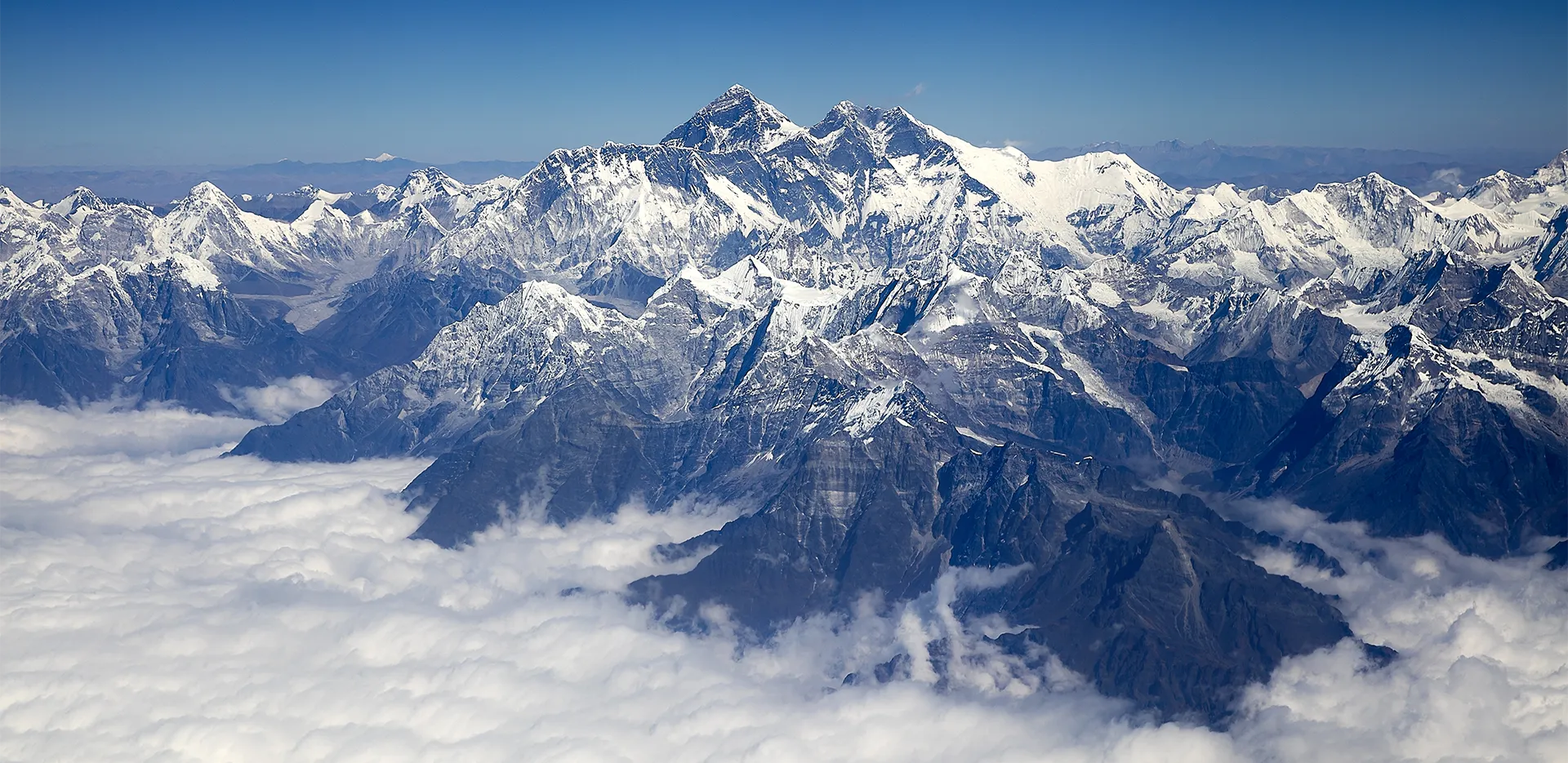 Mount Everest surrounded by clouds.