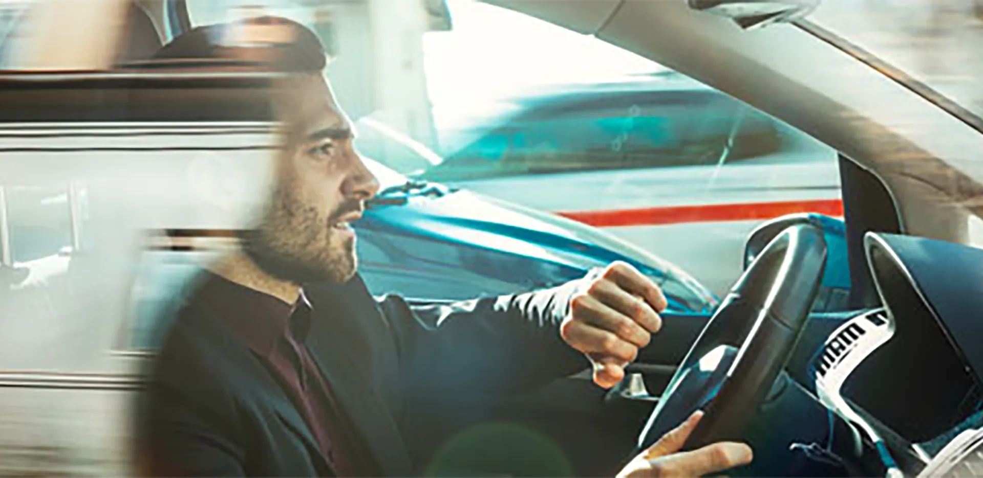 A person speeding while checking their watch.