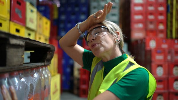 Exhausted employee at warehouse