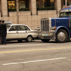 Car and semi tractor trailer in a fender bender in down town Washington DC. fleet managers