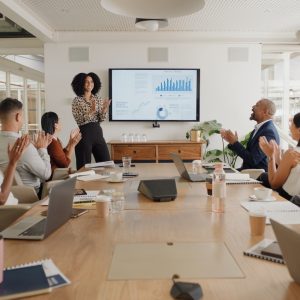 Business people, applause and presentation at conference with team in meeting, motivation or leadership at office. Group of happy employees clapping for proposal, collaboration or success at workshop