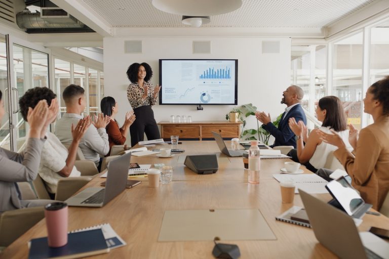 Business people, applause and presentation at conference with team in meeting, motivation or leadership at office. Group of happy employees clapping for proposal, collaboration or success at workshop