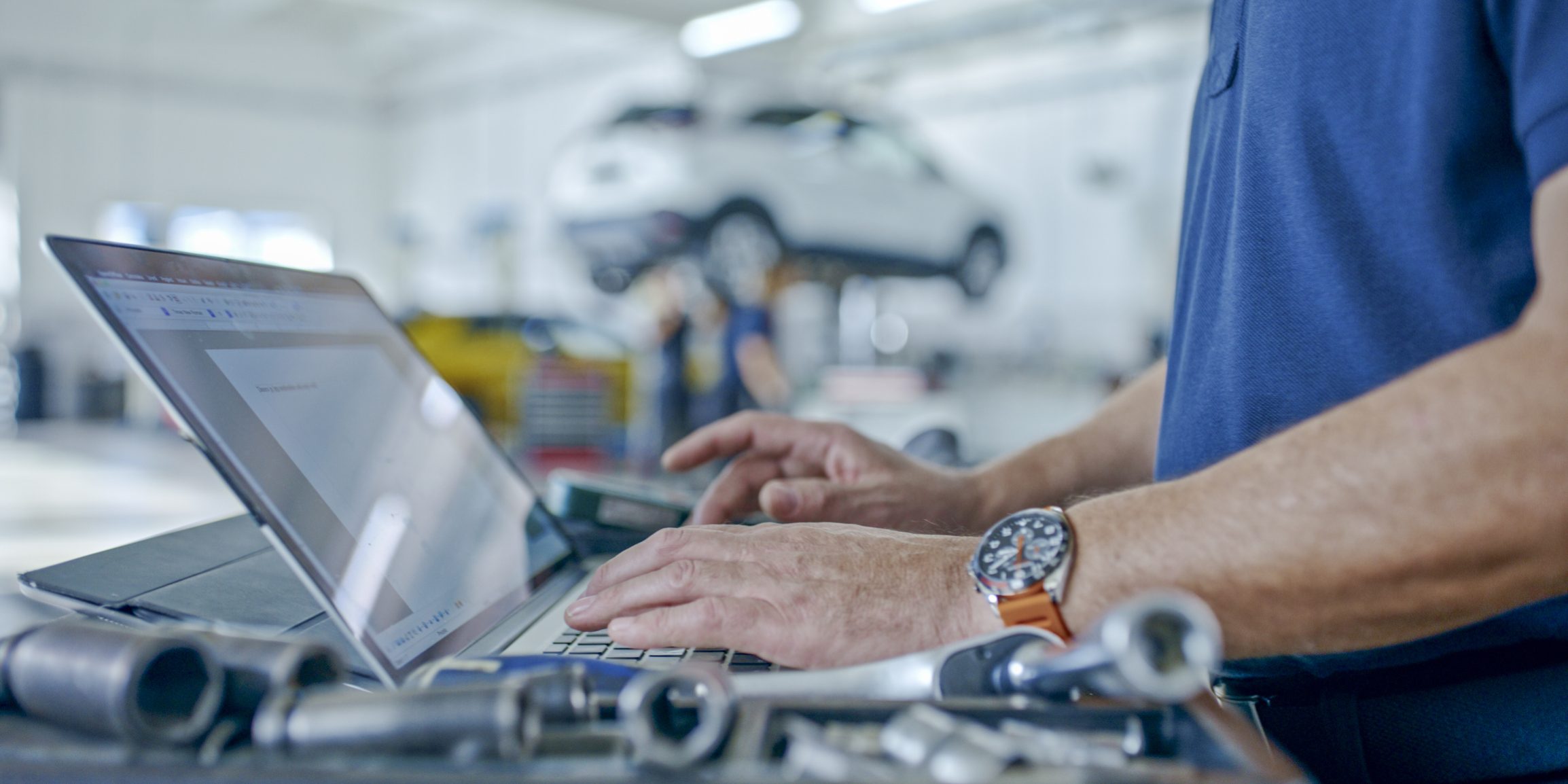 Hands Of Manager At The Auto Repair Shop Planning Operations Using Laptop